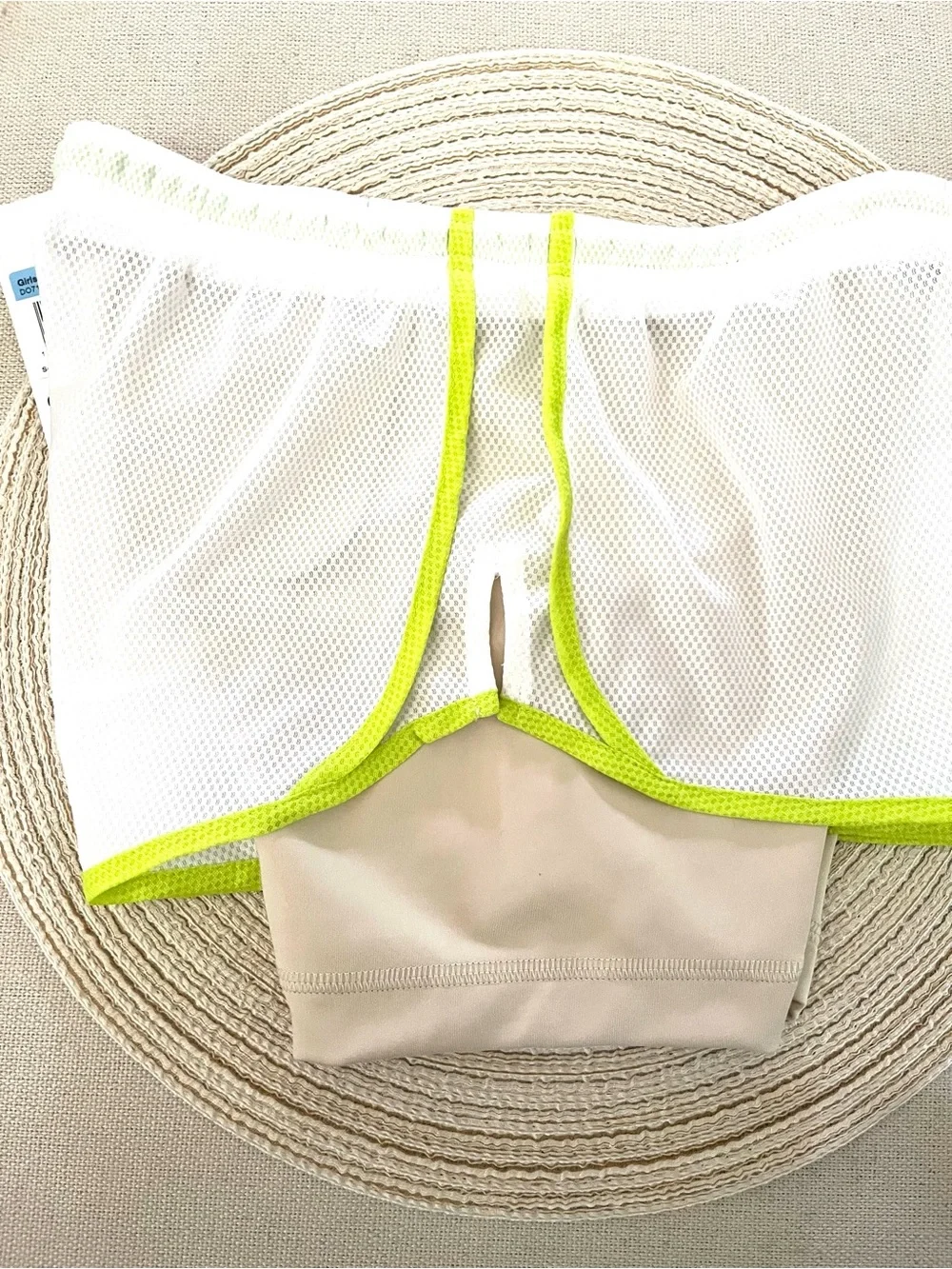 Nike Beige Sports Shorts with White Mesh Overlay and Neon Green Trim